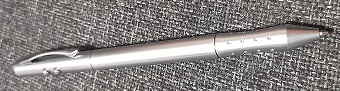 silver pen on a rug